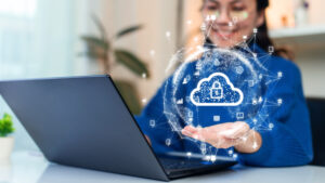 A woman uploading and transferring data from computer to cloud storage.